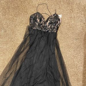 Never worn beautiful dress. Size M and has slits in both sides!